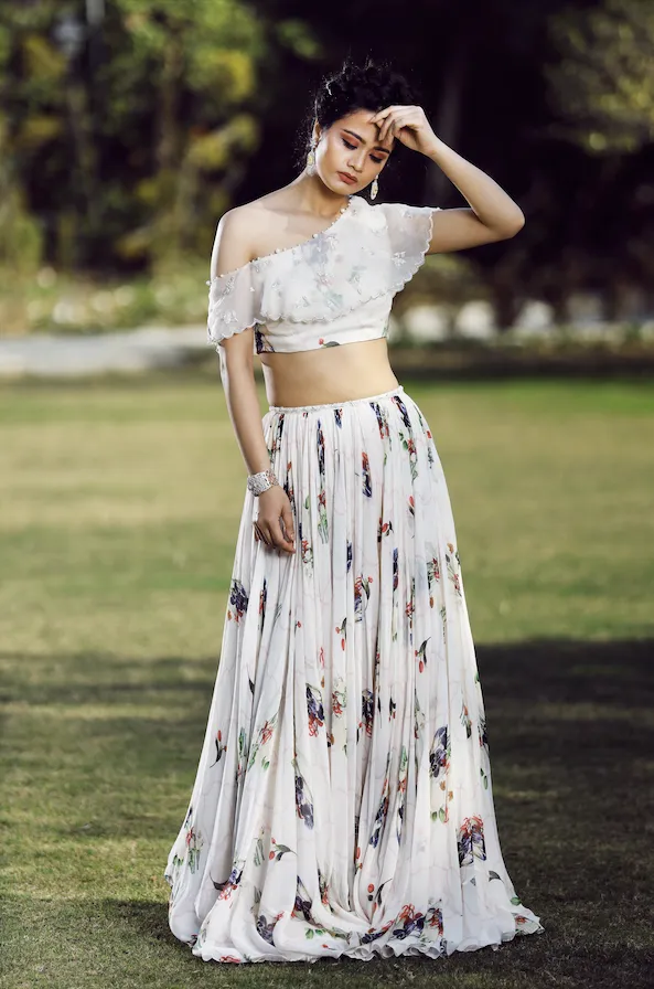 One off-shoulder Ivory lehenga set