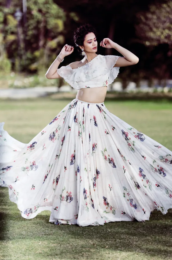 One off-shoulder Ivory lehenga set